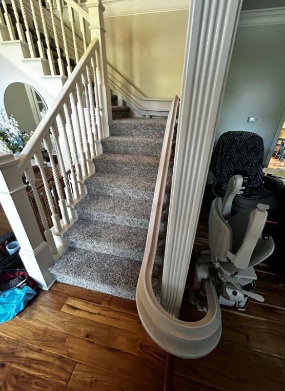 custom-curved-stairlift-with-180-degree-rail-overrun-at-bottom-landing-Indianapolis.JPG