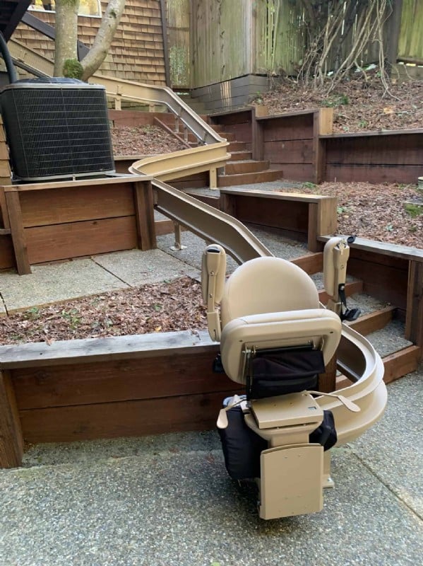 outdoor-Bruno-curved-stairlift-in-San-Francisco-with-components-folded-up.JPG