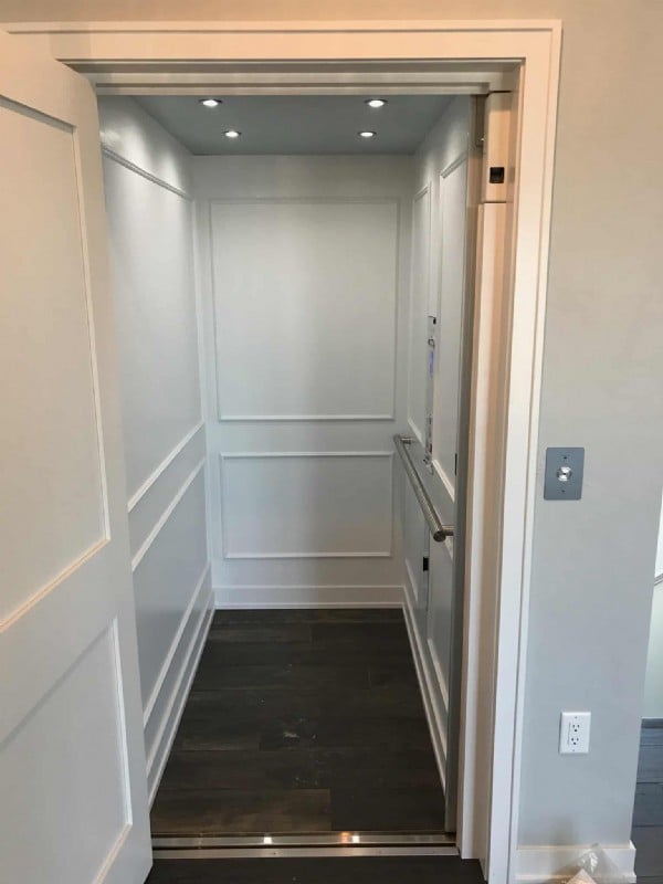 residential elevator with white interior installed by Lifeway Mobility in Los Angeles