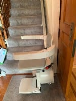 Bruno Elan stairlift at bottom landing of stairs in RI home.jpeg