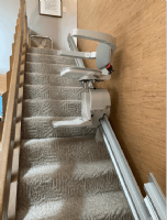 Bruno-Elan-stairlift-halfway-up-the-stairs-in-home-in-Indiana.PNG