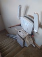 Bruno-Elan-stairlift-with-components-folded-up-at-top-landing-in-Wintrhop-Harbor-IL.JPG