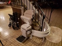 Bruno-Elite-curved-rail-stairlift-folded-at-bottom-of-stairs-in-Wilmette-home.jpg