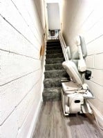 Bruno-curved-stairlift-with-components-folded-up-installed-by-Lifeway-Mobility.jpg