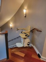 Handicare curved stairlift at top landing of home in Philadelphia by Lifeway Mobility