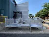 Lifeway technician standing on wheelchair ramp after install at college in Connecticut