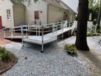 aluminum-wheelchair-ramp-installed-over-pavers-and-rocks-outside-of-Philadelphia-home.JPG