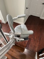 curved-stairift-at-bottom-landing-of-stairs-in-Clarksburg-Maryland.jpg