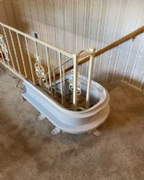 curved-stairlift-rail-overrun-at-top-landing-of-staircase-in-Hartford-City-IN.JPG