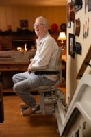 man-sitting-and-smiling-on-stairlift-in-Elk-Grove-home.jpg