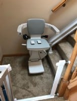 stairlift at bottom landing of stairs in home in New Grosvenor Dale Connecticut