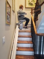 woman-rides-on-new-stairlift-in-home-in-Hanahan-SC-installed-by-Lifeway-Mobility.JPG