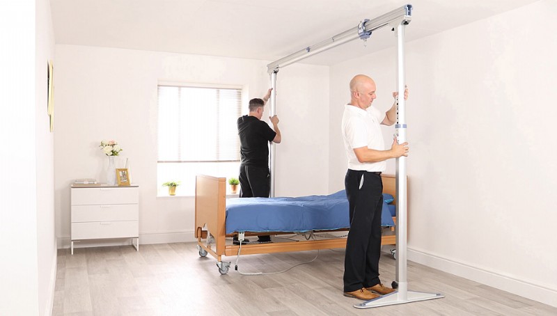 Lifeway Mobility technicians install overhead gantry system