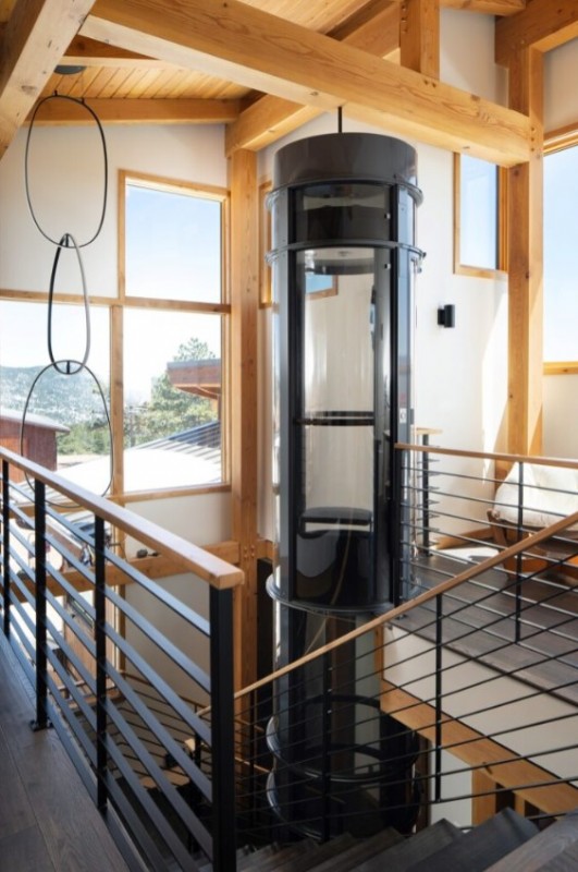 vacuum style home elevator with black frame installed by Lifeway Mobility