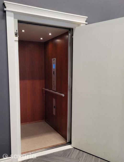 https://www.lifewaymobility.com/Customer-Content/www/Products/Photos/Full/Savaria_/Eclipse/Savaria-Eclipse-home-elevator-cherry-cab-finish-by-Lifeway-Mobility.jpg