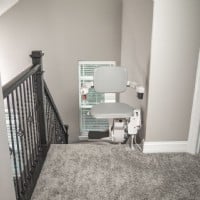 Bruno Elite curved stairlift swiveled 90 degerees at top landing