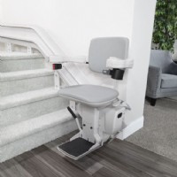 Bruno curved rail stairlift installed by Lifeway Mobility at bottom landing of stairs