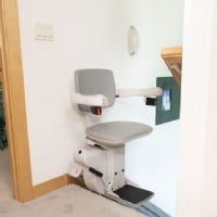 Bruno Elite stairlift with new chair at top landing of stairs
