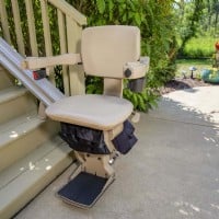 Bruno outdoor straight stairlift  with new seat at bottom of stairs 