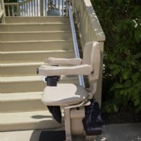 Bruno outdoor straight stairlift at bottom of stairs side view new chair