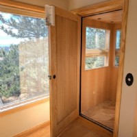 custom home elevator with wood door installed by Lifeway Mobility
