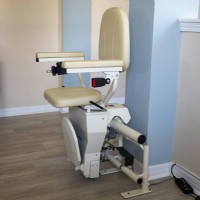 Harmar Helix curved stairlift at top landing of home that was installed by Lifeway Mobility