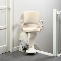 Otolift stairlift by Lifeway Mobility at top of stairs