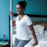 woman using super pole to safely exit bed
