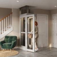 woman carrying laundry basket walks into Pollock home lift