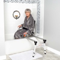woman using SB ShowerGlyde from Lifeway Mobility to safely transfer into bathtub