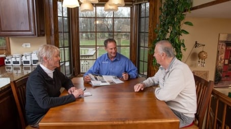 Lifeway consultant sitting with customers at table in home in San Diego CA