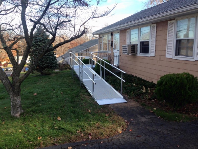 aluminum modular wheelchair ramp to provide access to front door of home