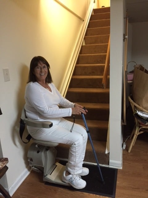 Lifeway-Mobility-customer-riding-Bruno-Elan-stairlift