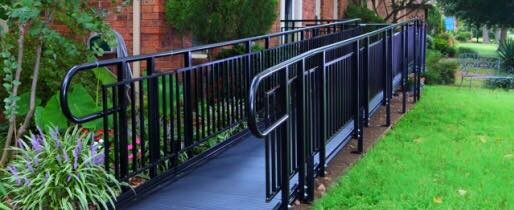 Commercial aluminum ramp installed in New England with black powder-coated finish