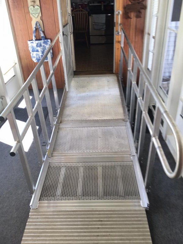 Solid surface portable ramp used at entry