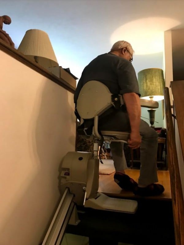 Lifeway-Minnesota-customer-swiveling-seat-of-stairlift-at-top-landing.JPG