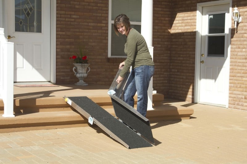 Woman folding the Suitcase Trifold AS Ramp