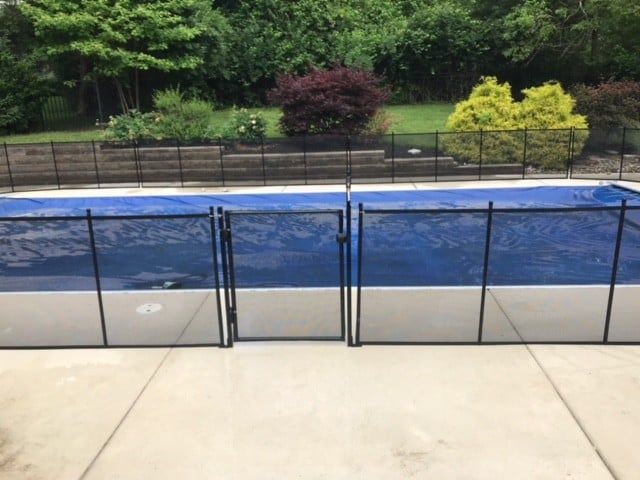 Protect A Child mesh pool fence around clear-covered pool installed by Lifeway Mobility Indiana