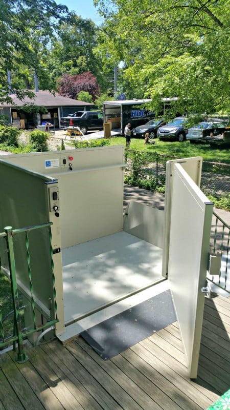 door-of-vertical-platform-lift-open-at-top-entrance-outside-of-home-in-Wilmette-Illinois.jpg