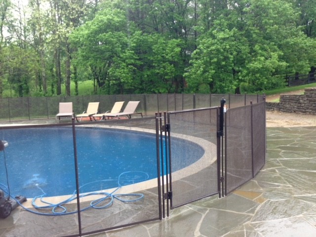 Well Lit Flat Stone pool fence finished