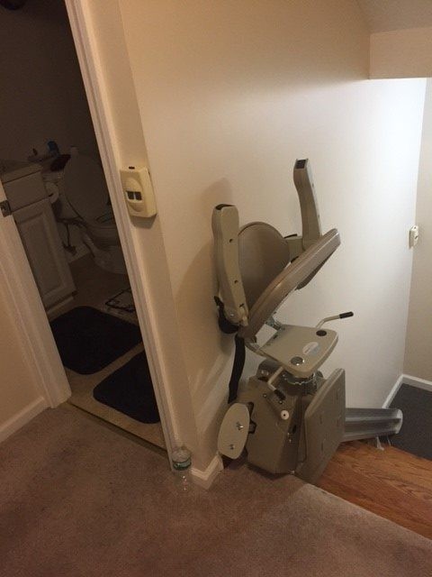 stair-lift-at-top-landing-with-components-folded-up-in-West-Haven-Connecticut-home