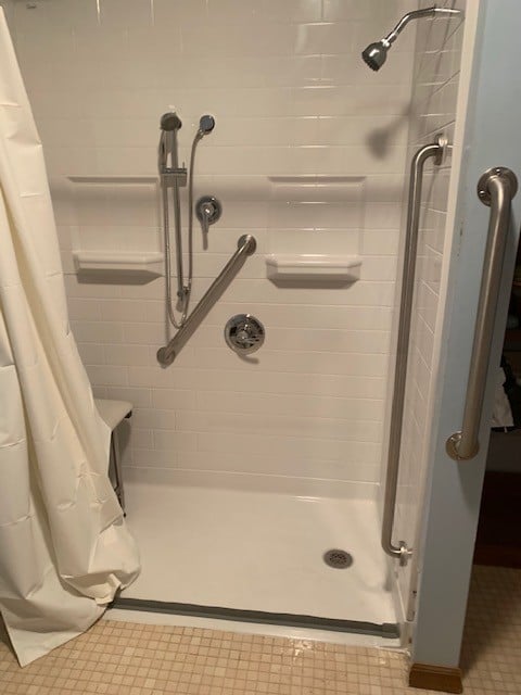 barrier-free-shower-with-grab-bars-and-in-wall-shower-niches.JPG