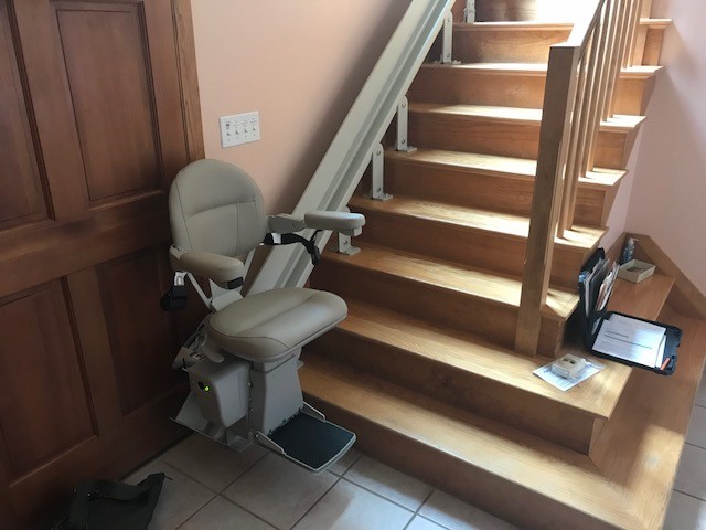 curved stairlift at bottom landing in home in Framingham Mass