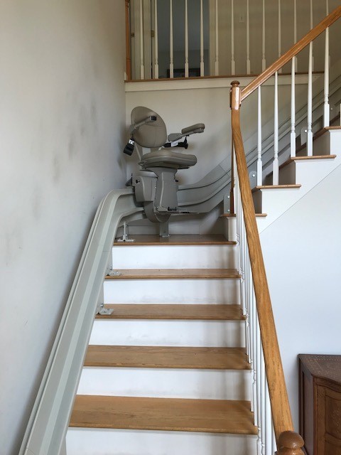 curved-stairlift-halfway-up-staircase-in-home-in-Massachusetts.jpg