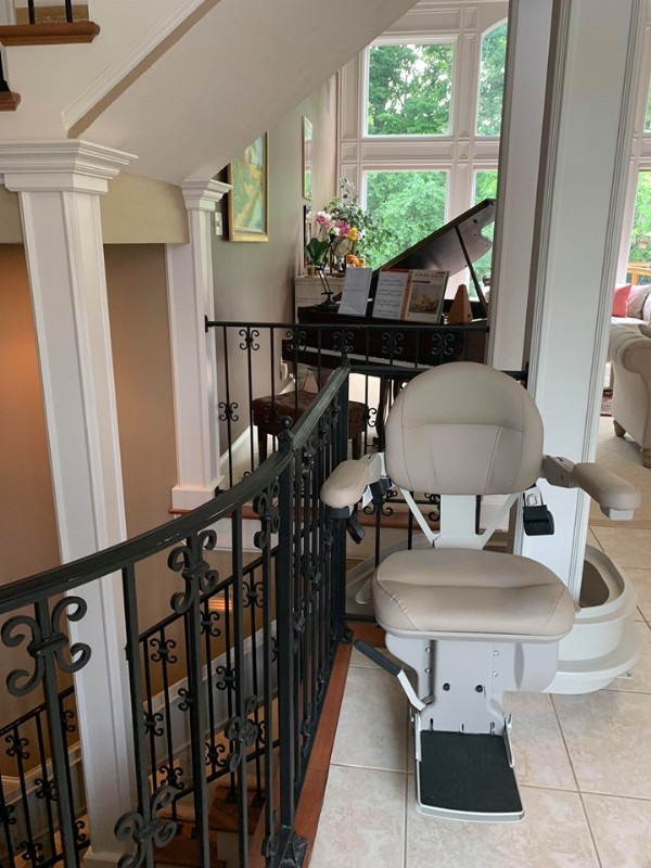 custom-curved-stairlift-with-rail-overrun-at-top-landing.jpg