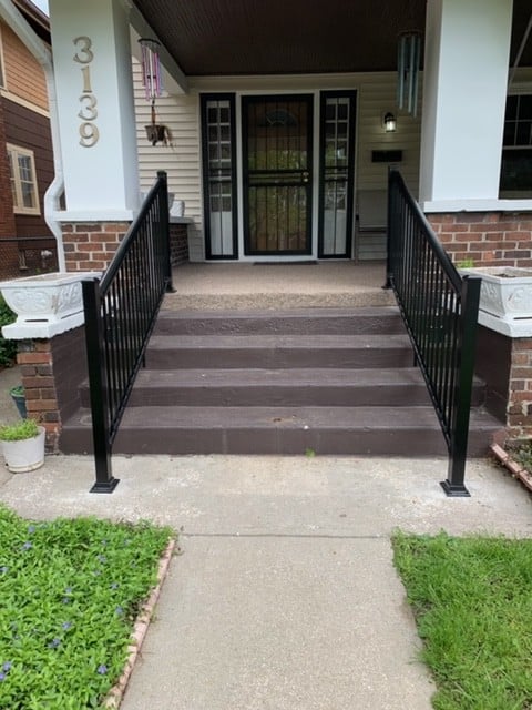 pair-of-handrails-on-outdoor-staircase-for-front-door-access.JPG