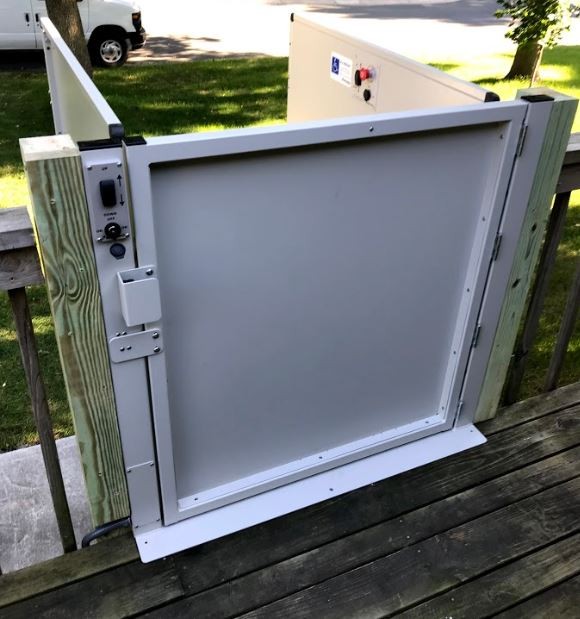 upper-level-landing-gate-of-porch-lift-installed-for-deck-access-outside-of-home-in-Minnesota.JPG