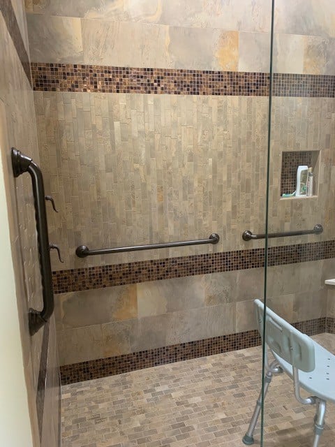 vertical and two horizontal grab bars in roll in shower Indiana