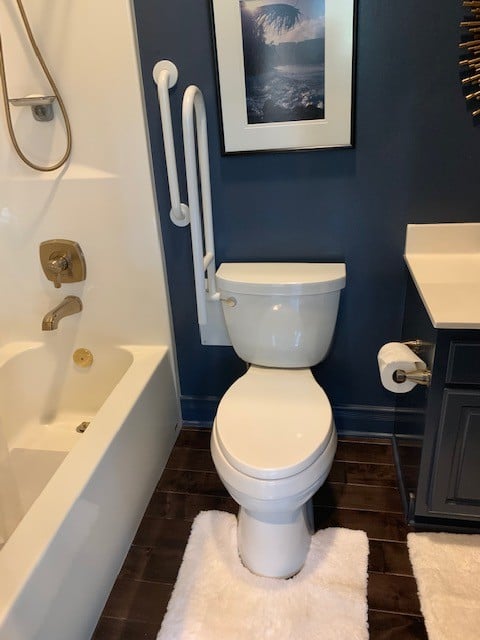 wall mounted toilet safety rail flipped upward