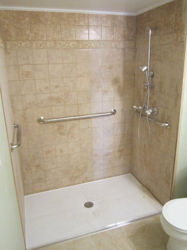 wheelchair-accessible-shower-with-rubber-threshold-and-grab-bars.jpg